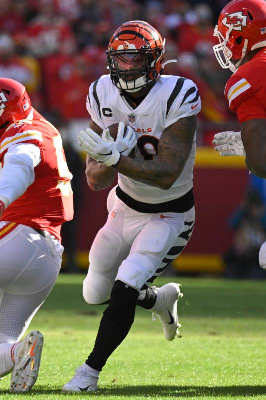 Cincinnati Bengals running back Joe Mixon runs through the Kansas City Chiefs defense during th ...