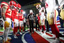 Referee Bill Vinovich (52) flips the coin during the coin toss ceremony before the NFL Super Bo ...