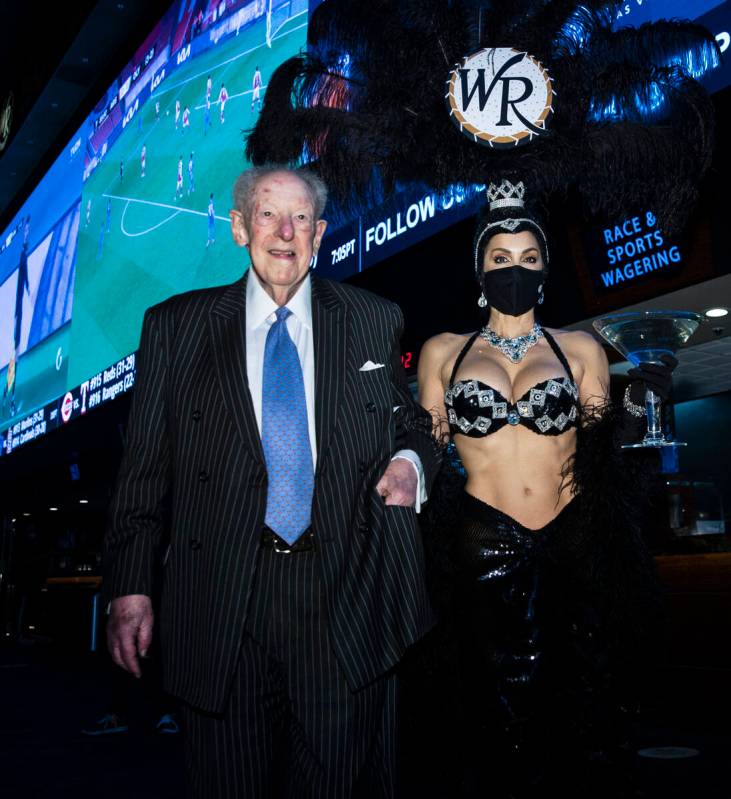 Former Las Vegas Mayor Oscar Goodman leaves Westgate Superbook with showgirl Jennifer Gagliano ...
