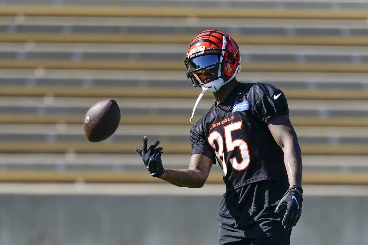 Cincinnati Bengals' Tee Higgins catches a ball practice Thursday, Feb. 10, 2022, in Los Angeles ...