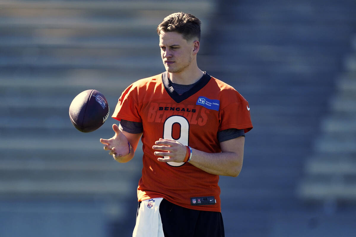 Cincinnati Bengals quarterback Joe Burrow (9) warms up during NFL football practice Wednesday, ...