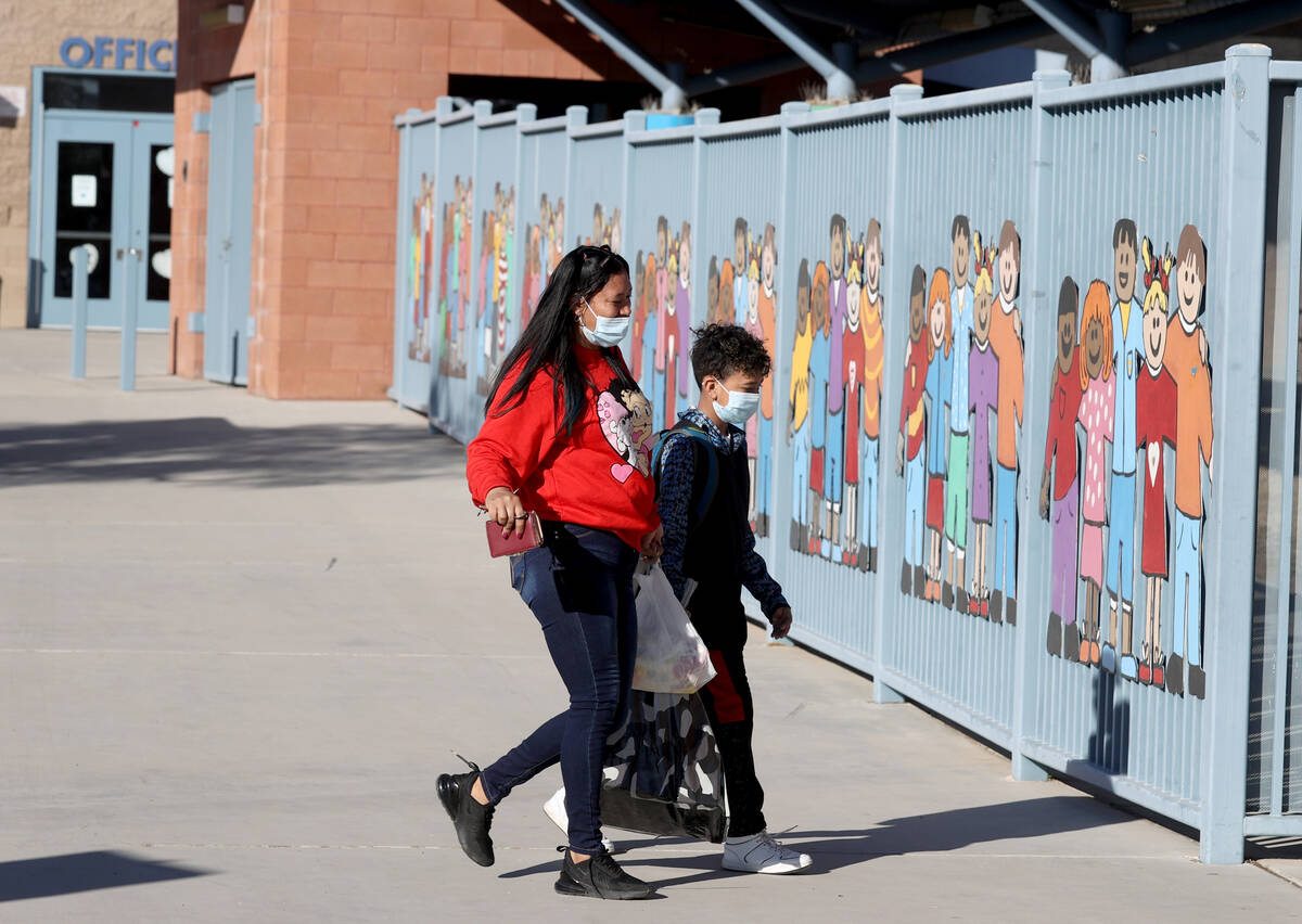Sarahi Gomez drops off her son Jose Rodriguez, 10, at Wendell Williams Elementary School in Las ...