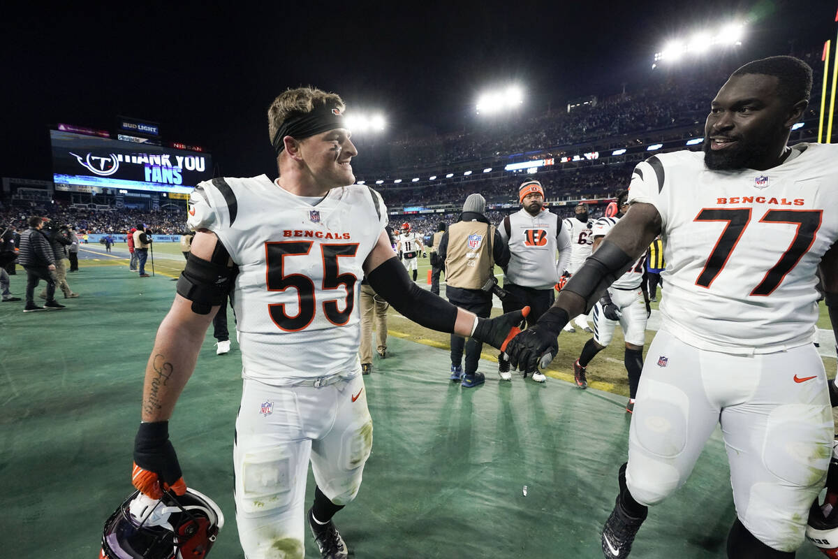 Cincinnati Bengals linebacker Logan Wilson (55) and Cincinnati Bengals guard Hakeem Adeniji (77 ...