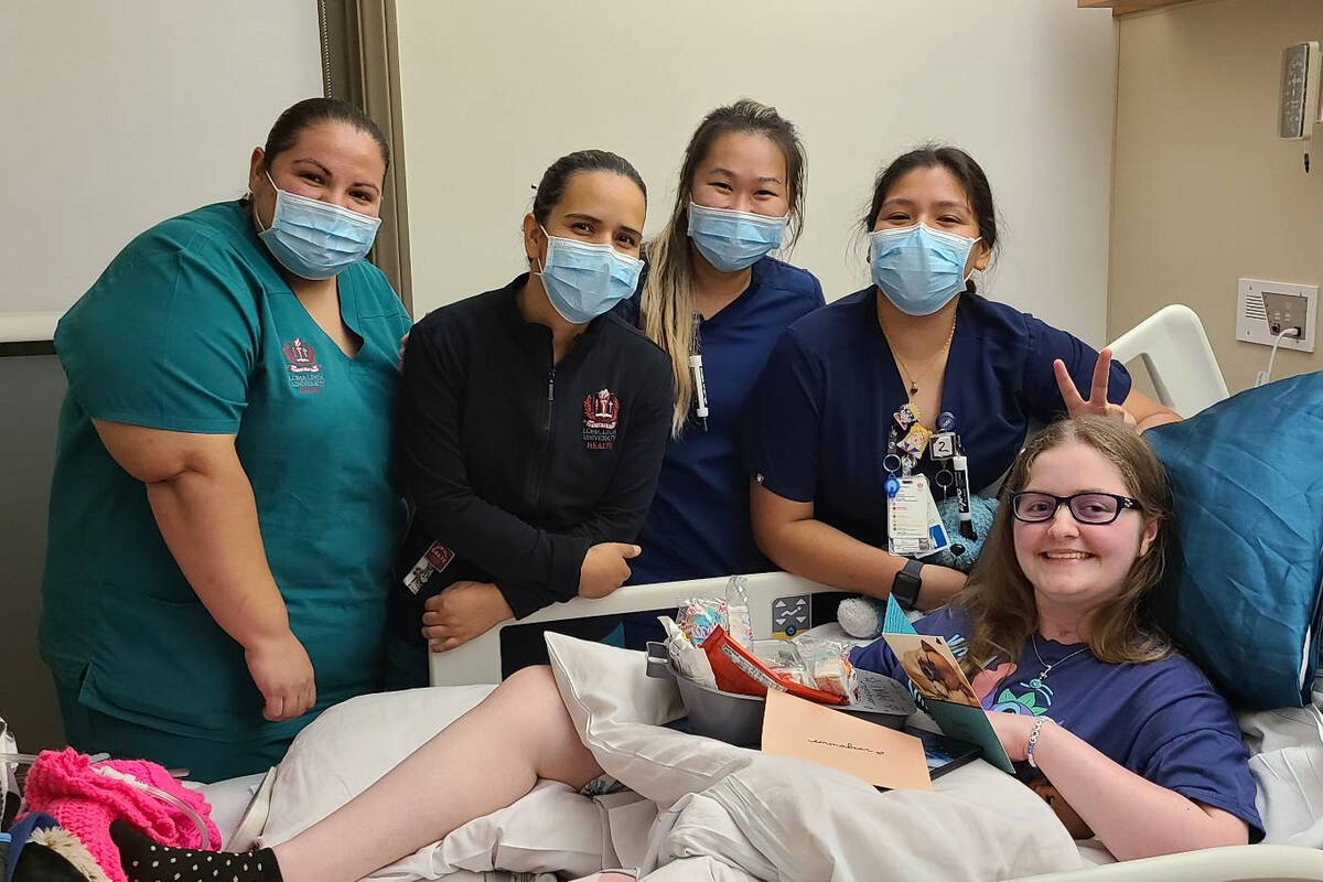 Emma Burkey with hospital staff at medical facilities at Loma Linda University in California. ( ...