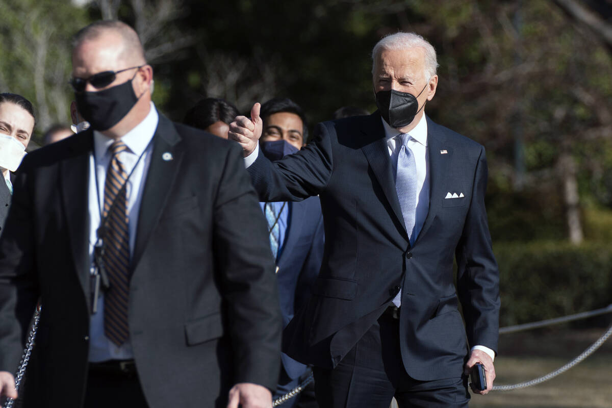 President Joe Biden gives a thumbs up as he walks to board Marine One on the South Lawn of the ...