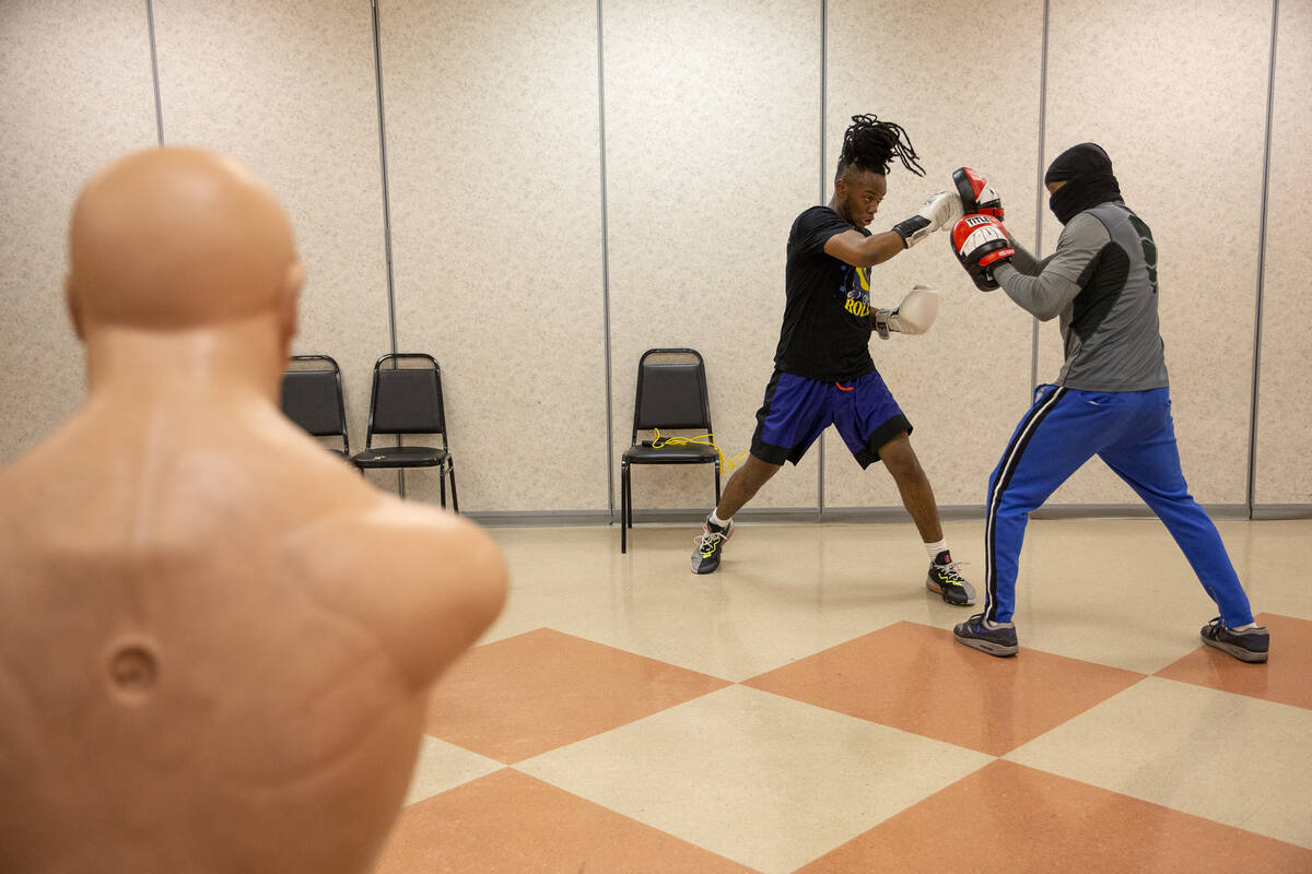 Terill Joiner, 18, trains with Brother Greg at Doolittle Community Center on Wednesday, Feb. 9, ...