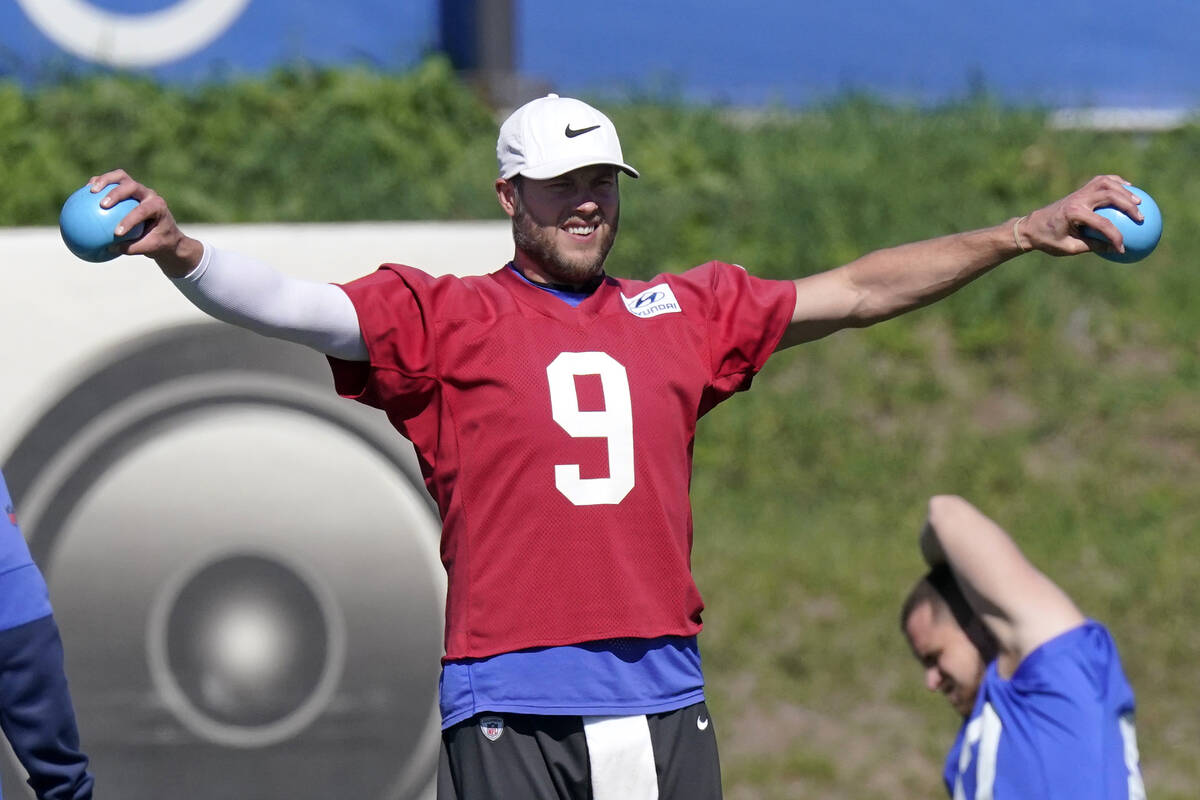 Los Angeles Rams quarterback Matthew Stafford warms up during practice for an NFL Super Bowl fo ...