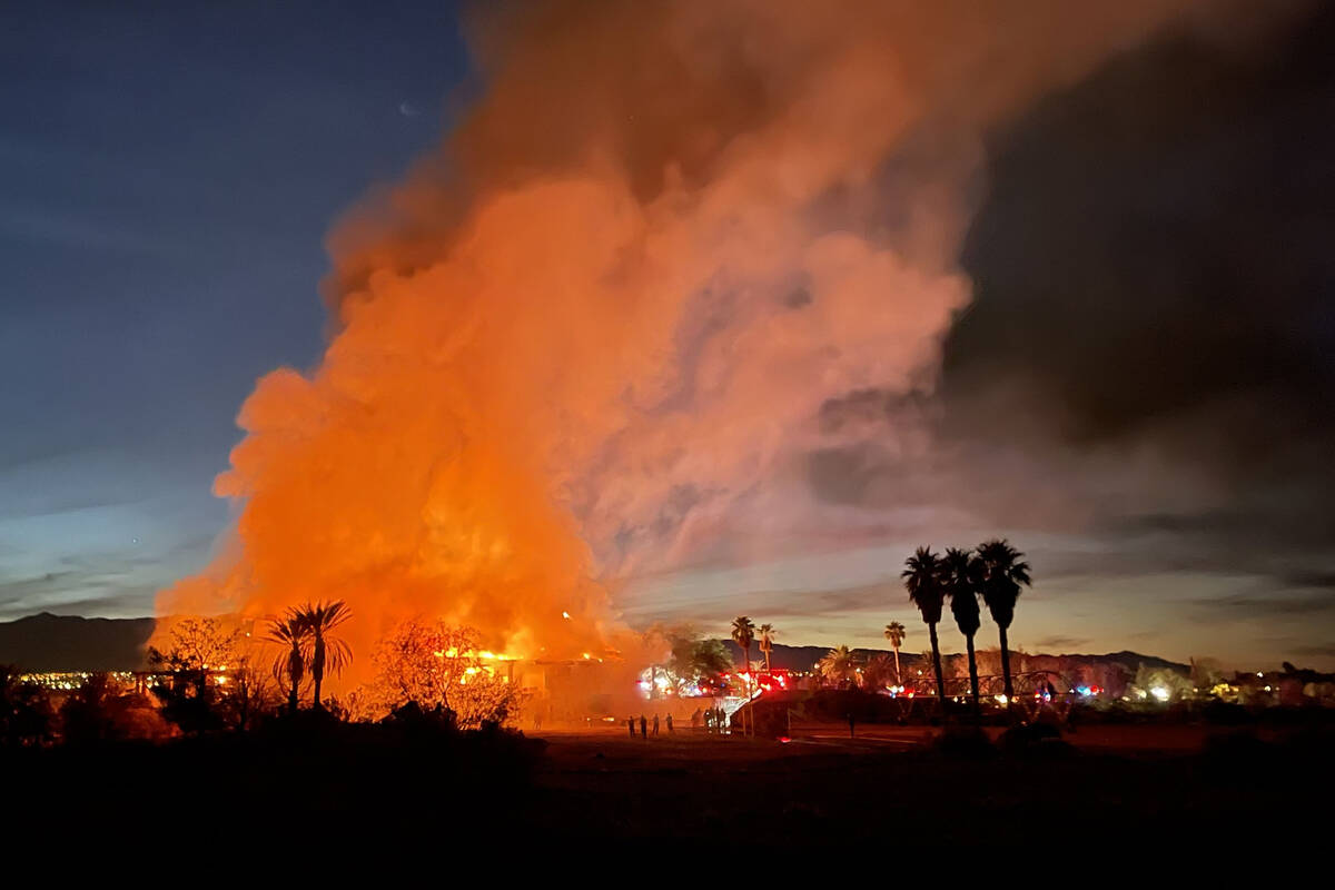 Firefighters work to put out a fire at a vacant clubhouse at Silverstone Golf Club on Friday, N ...