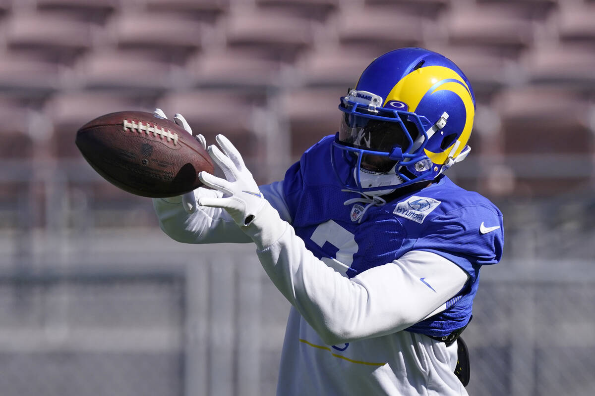 Los Angeles Rams wide receiver Odell Beckham Jr. catches a pass during practice for an NFL Supe ...