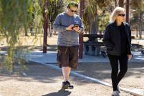 A couple, who declined to give their names, walk at Sunset Park on Wednesday, Feb 9, 2022, in L ...