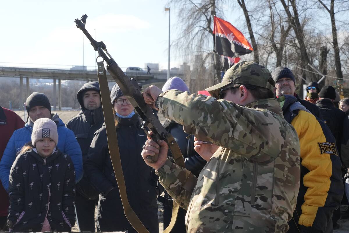 An instructor shows a Kalashnikov assault rifle as members of a Ukrainian far-right group train ...