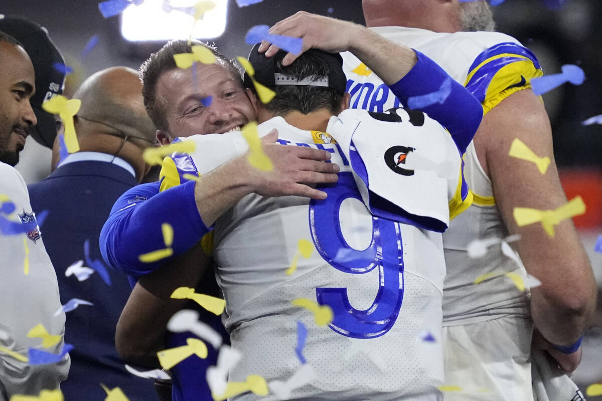 Los Angeles Rams quarterback Matthew Stafford (9) hugs head coach Sean McVay after the NFL Supe ...