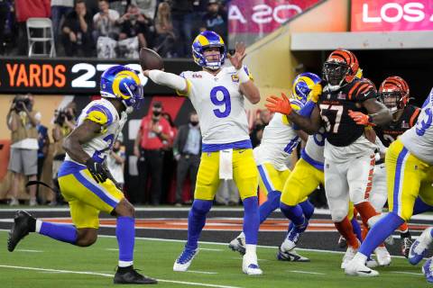Los Angeles Rams quarterback Matthew Stafford (9) throws a touchdown pass to wide receiver Coop ...