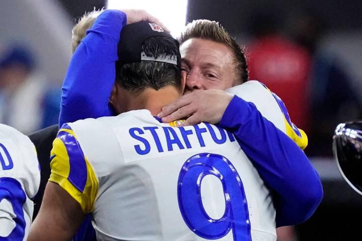 Los Angeles Rams quarterback Matthew Stafford (9) embraces Los Angeles Rams head coach Sean McV ...