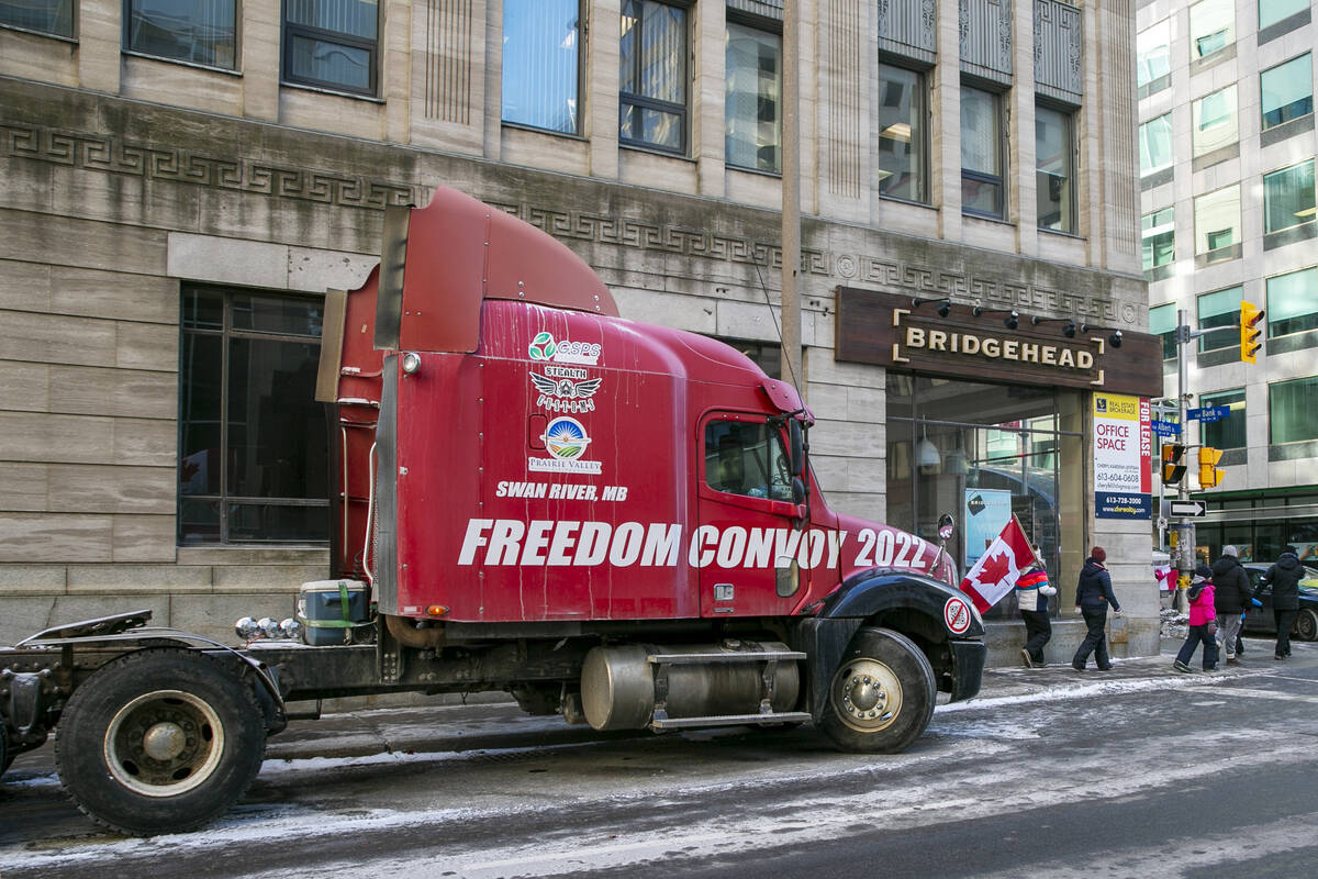 The words "Freedom Convoy 2022" are visible on a truck that is part of a demonstratio ...