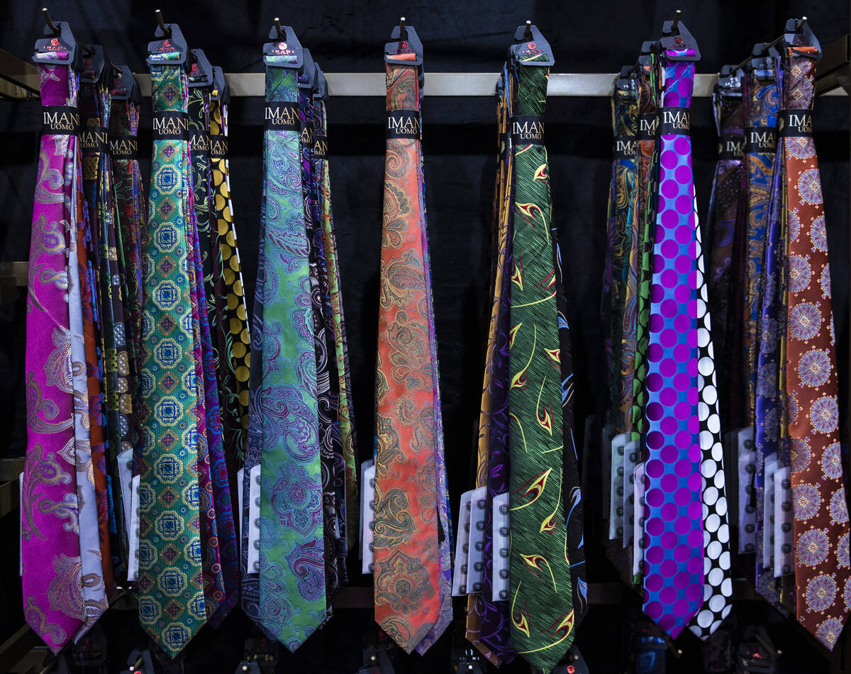 Designer ties at Imani UOMO’s booth are displayed at the biannual MAGIC show, a trend-dr ...