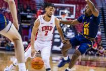 UNLV Rebels guard Justin Webster (2) looks to drive the lane past California Golden Bears guard ...