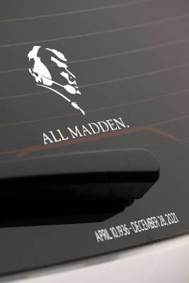 An Oakland Raiders fan's auto sports a decal commemorating former NFL football coach and televi ...