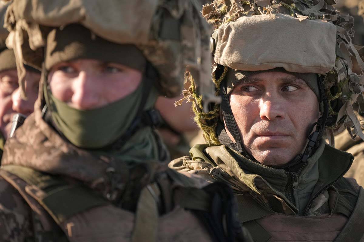 Ukrainian servicemen wait in formation before an exercise in the Joint Forces Operation, in the ...