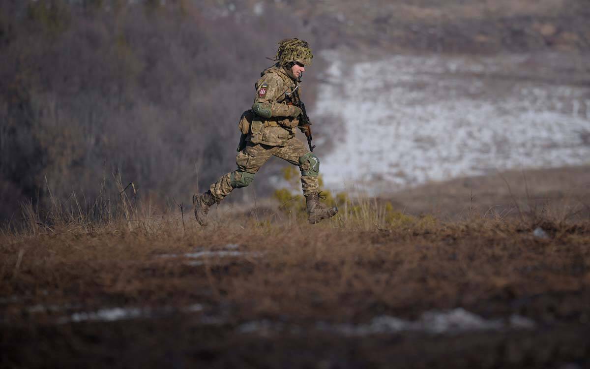 A Ukrainian serviceman runs during an exercise in the Joint Forces Operation, in the Donetsk re ...