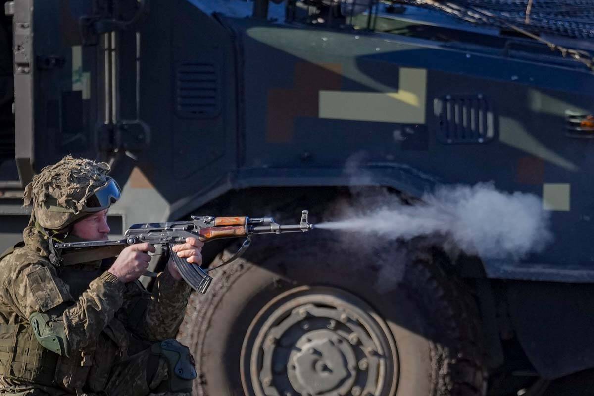 A Ukrainian serviceman fires his weapon during an exercise in the Joint Forces Operation, in th ...