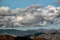 Heavy storm clouds move in over the hills over the Hollywood sign in Los Angeles on Sunday, Dec ...
