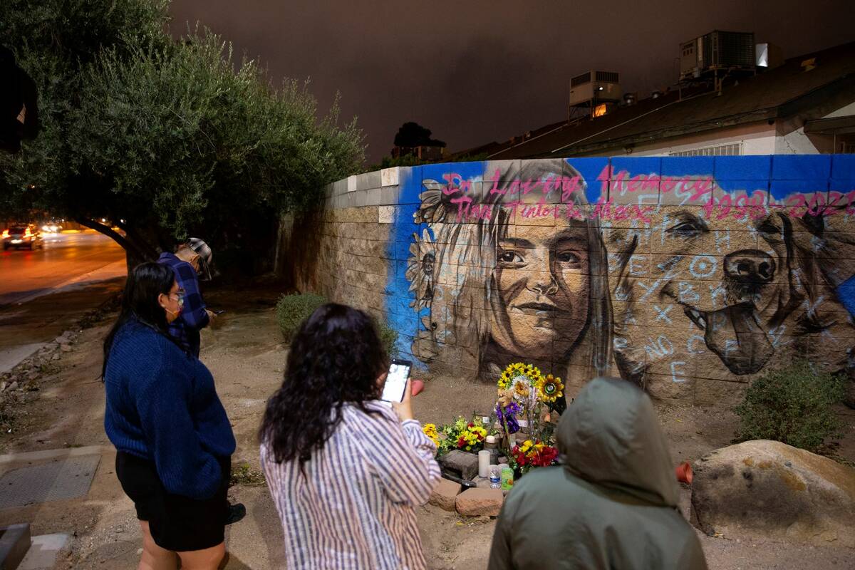 The Volpe family visits a mural of Tina Tintor and her dog Max on Tuesday, Feb. 15, 2022, in La ...