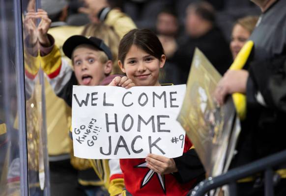 Fans of Golden Knights center Jack Eichel (9) watch him warm up before the start of an NHL hock ...