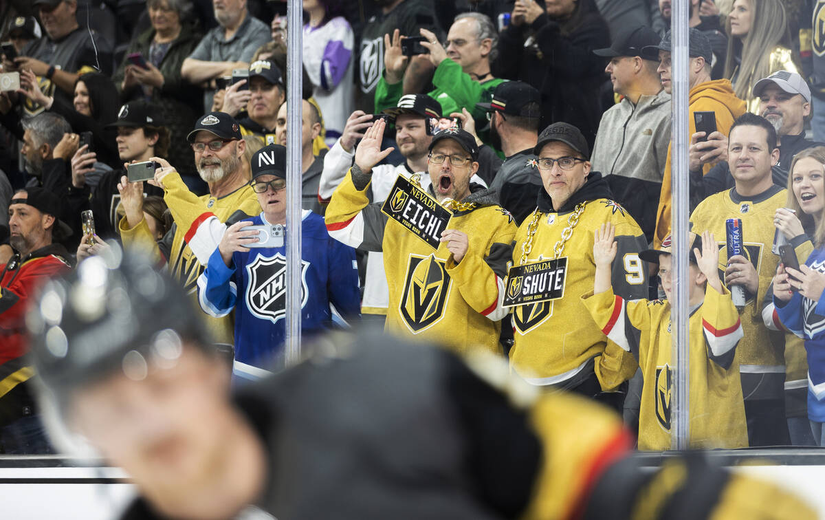 Fans of Golden Knights center Jack Eichel (9) watch him warm up before the start of an NHL hock ...