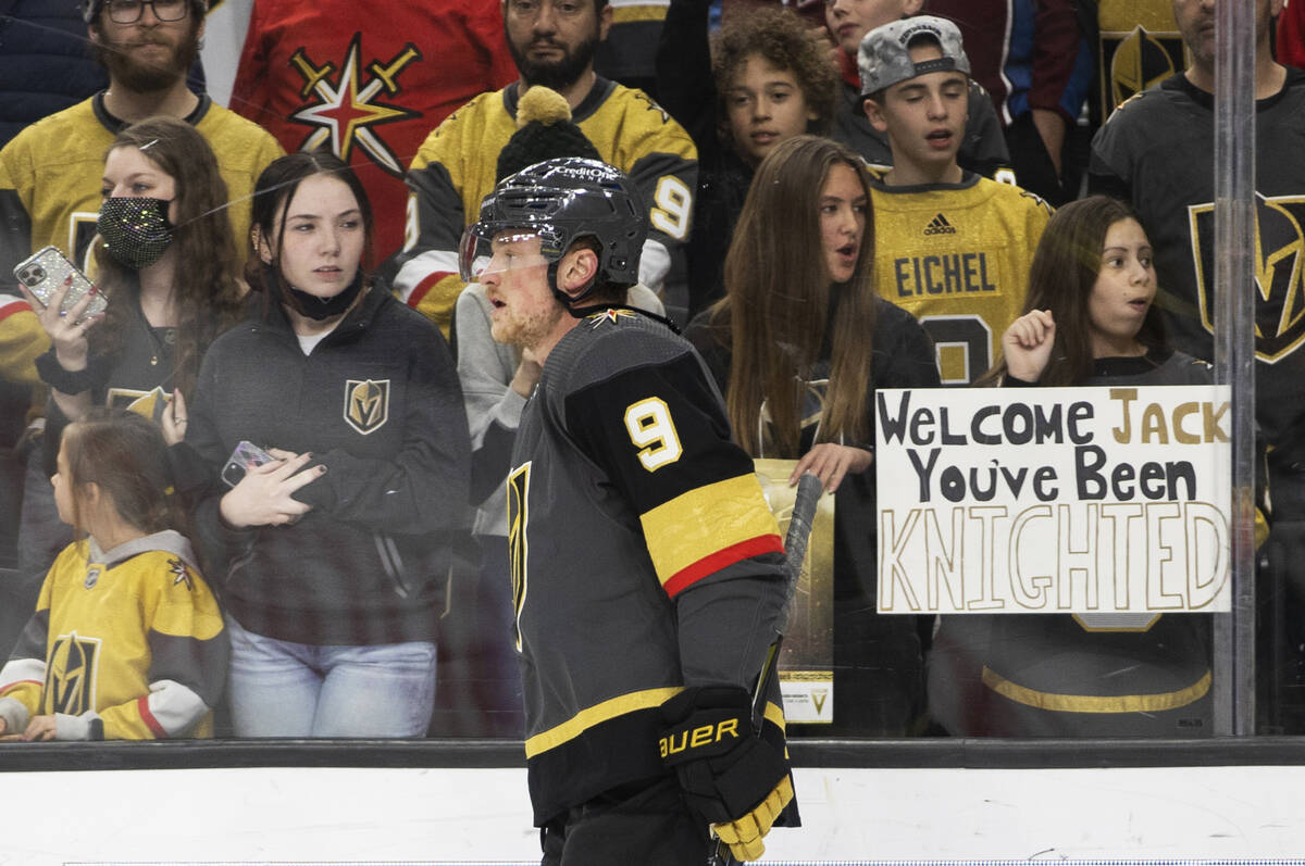 Fans of Golden Knights center Jack Eichel (9) watch him warm up before the start of an NHL hock ...