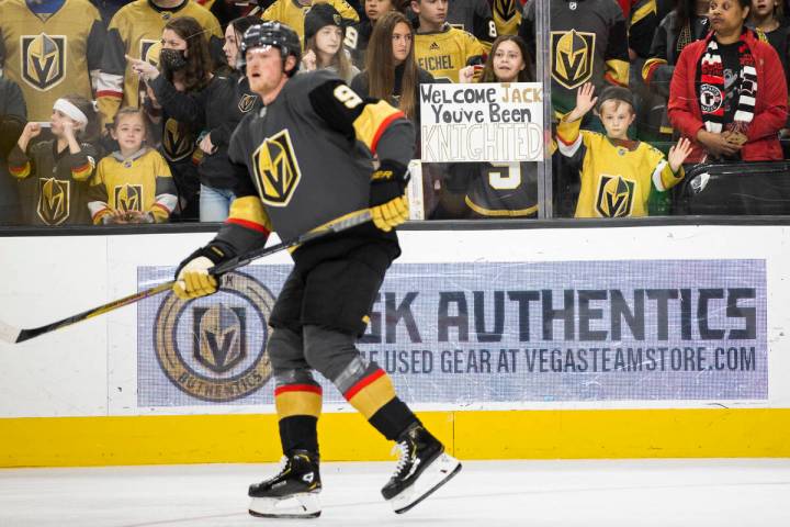 Fans of Golden Knights center Jack Eichel (9) watch him warm up before the start of an NHL hock ...