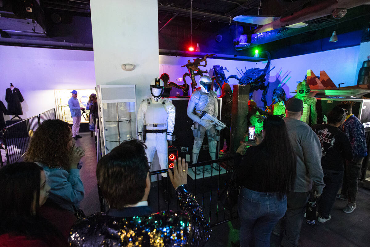 People explore The Movie Prop Experience during a preview at Neonopolis on Fremont Street Thurs ...