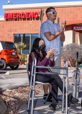 Newly released patient Kristen Miranda applauds with husband Preston during a nondenominational ...