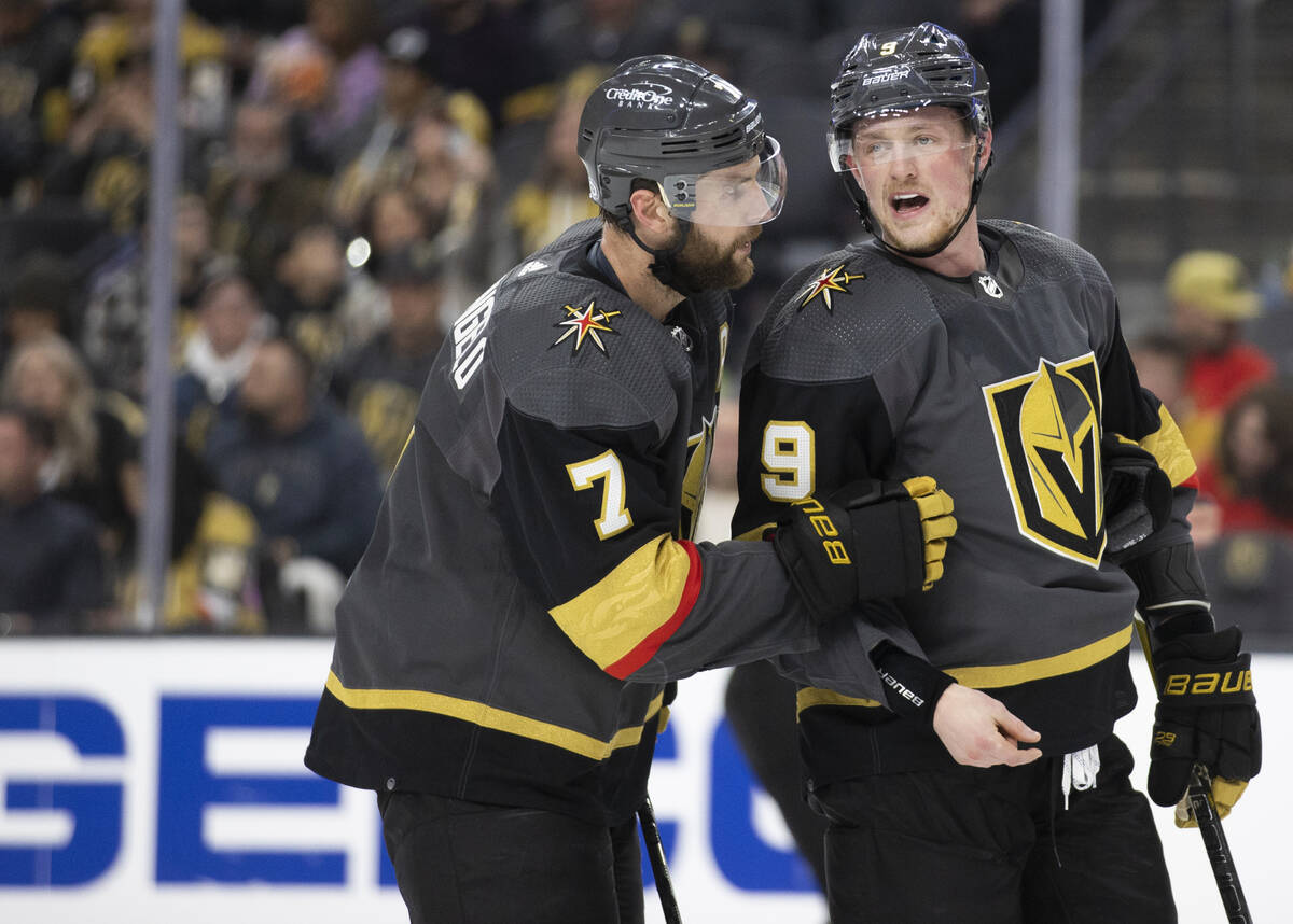 Golden Knights center Jack Eichel (9) talks with Golden Knights defenseman Alex Pietrangelo (7) ...