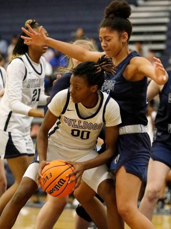 Centennial High School's Kaniya Boyd (00) looks to pass against Spring Valley High School's Jad ...