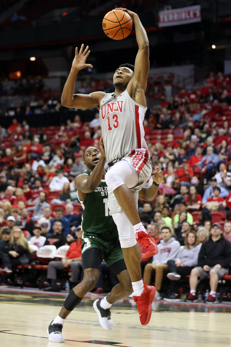 UNLV’s Bryce Hamilton (13) goes up for a dunk against Colorado State in the second half ...