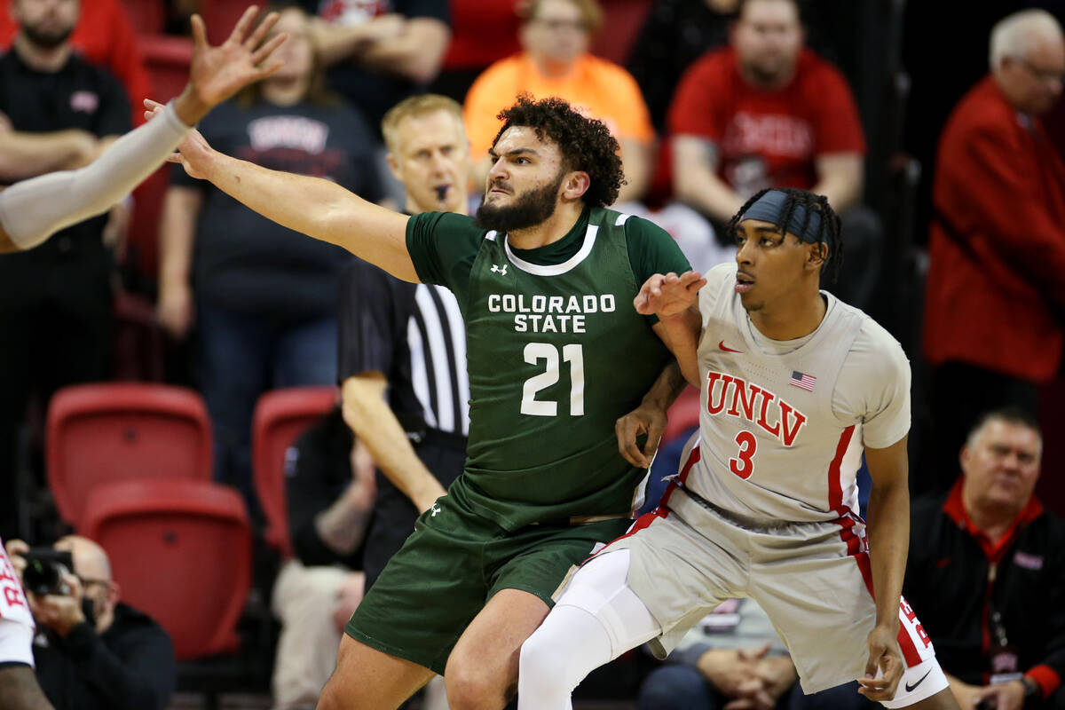 UNLV’s Kendle Moore (3) defends against Colorado State’s David Roddy (21) in the ...