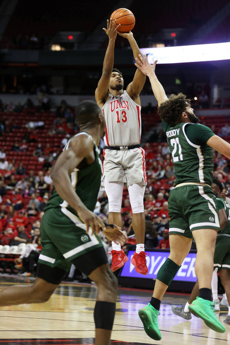 UNLV’s Bryce Hamilton (13) goes up for a shot against Colorado State’s David Rodd ...