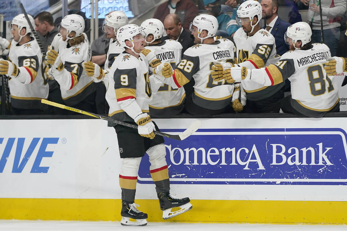 Vegas Golden Knights center Jack Eichel (9) is congratulated by teammates after scoring against ...