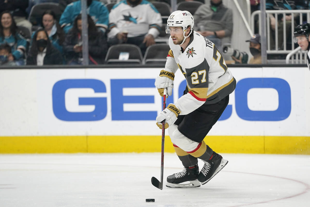 Vegas Golden Knights defenseman Shea Theodore (27) skates with the puck against the San Jose Sh ...