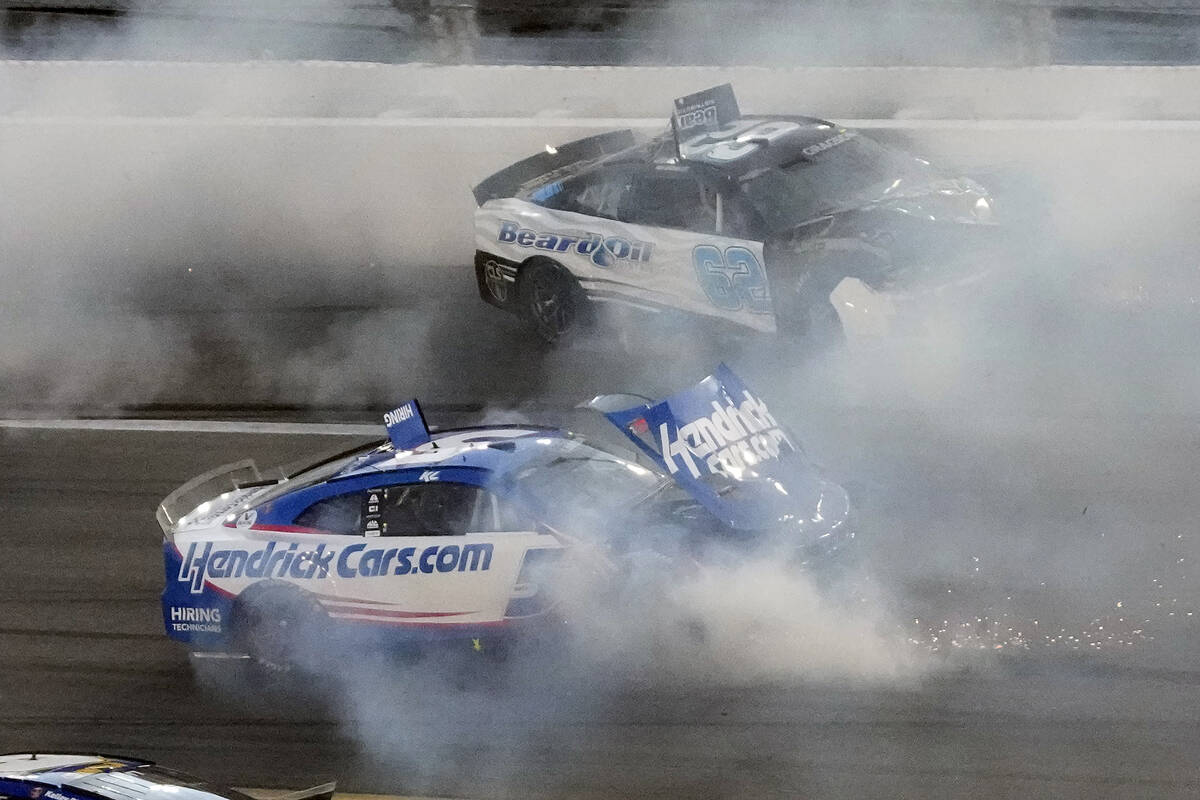 Kyle Larson (5) and Noah Gragson (62) crash during the NASCAR Daytona 500 auto race Sunday, Feb ...