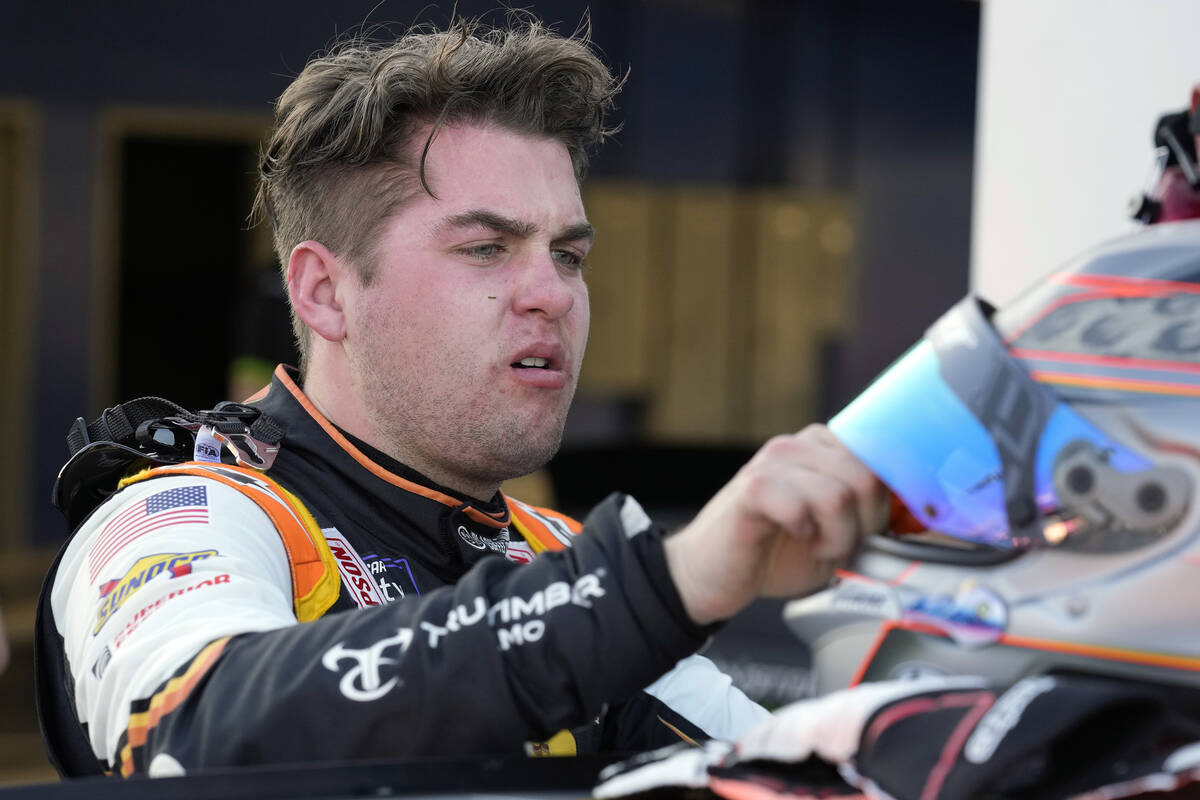 Noah Gragson takes off his helmet after a NASCAR Xfinity Series auto race practice Friday, Feb. ...