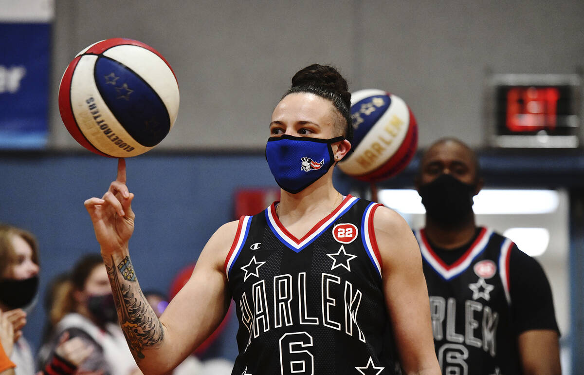 Mia Hopkins, a Pittston native and member of the Harlem Globetrotters, walks into the gym of Ma ...