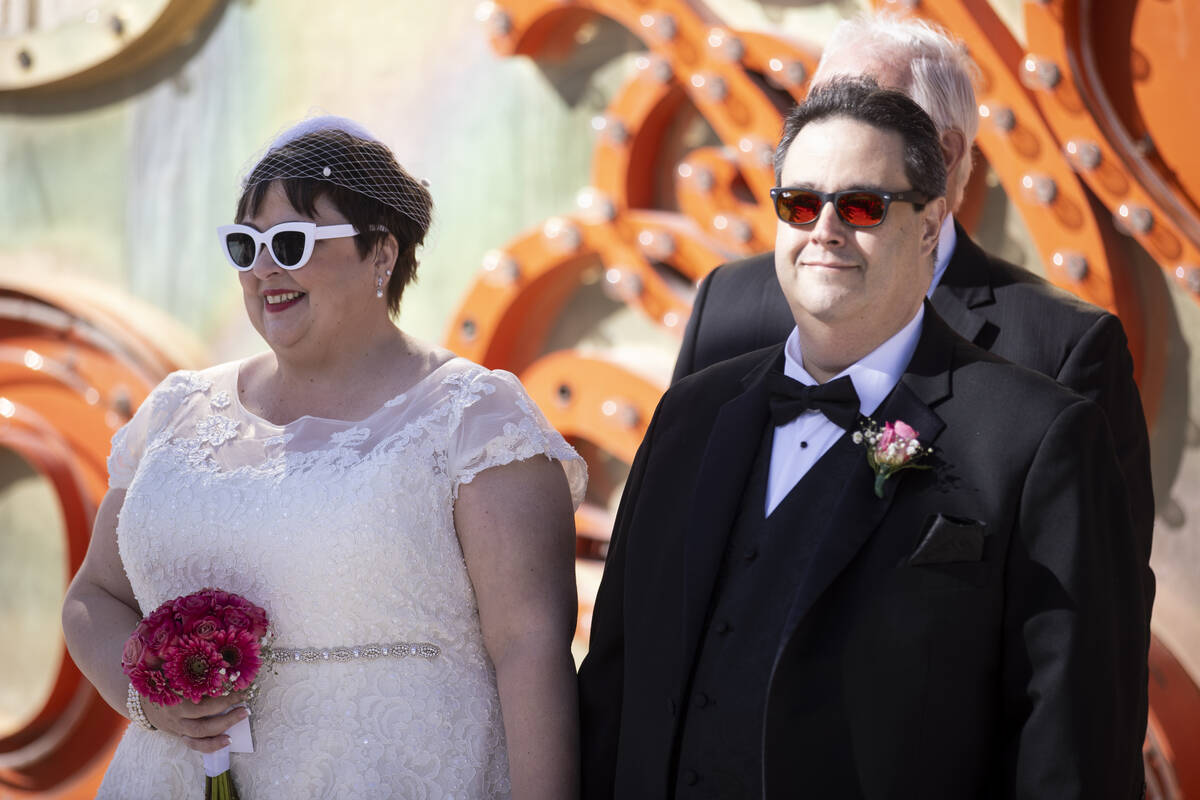 Stephanie Hippensteel, left, and Javier Ansoleaga, face their family and friends at the beginni ...