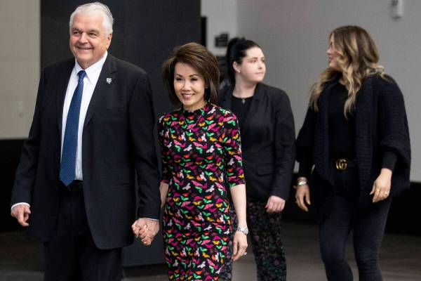 Nevada Gov. Steve Sisolak, from left, his wife Kathy, and daughters Carley and Ashley, enter Al ...