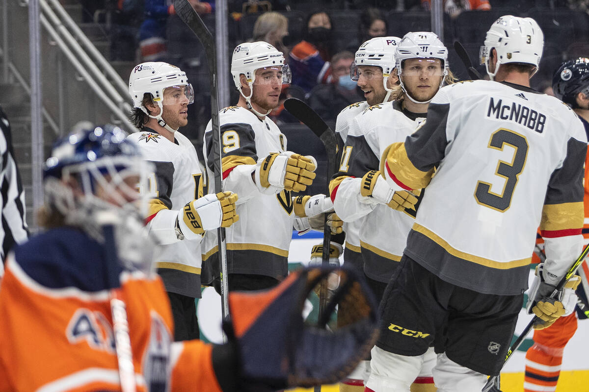 Vegas Golden Knights players celebrate a goal against the Edmonton Oilers during the third peri ...