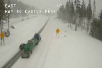 Light traffic makes its way in snowy conditions along Interstate 80 at Castle Peak, Calif., Tue ...