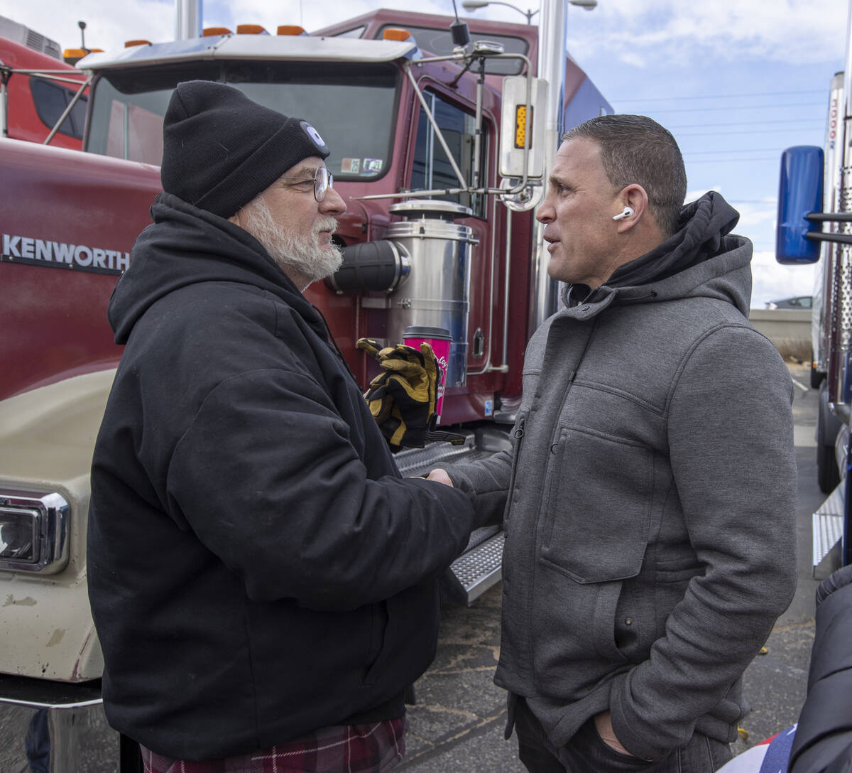 Trucker Ron Coleman of Reno, left, chats with Nevada governor candidate Joey Gilbert during a d ...