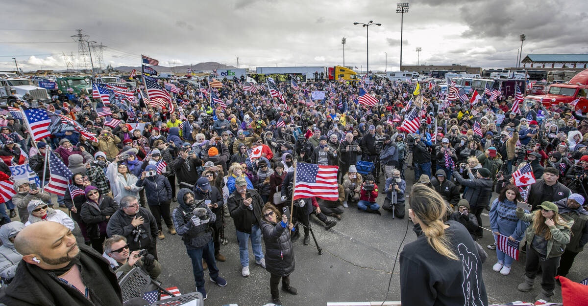 Attendees sing the National Anthem during a departure event for The People’s Convoy at A ...