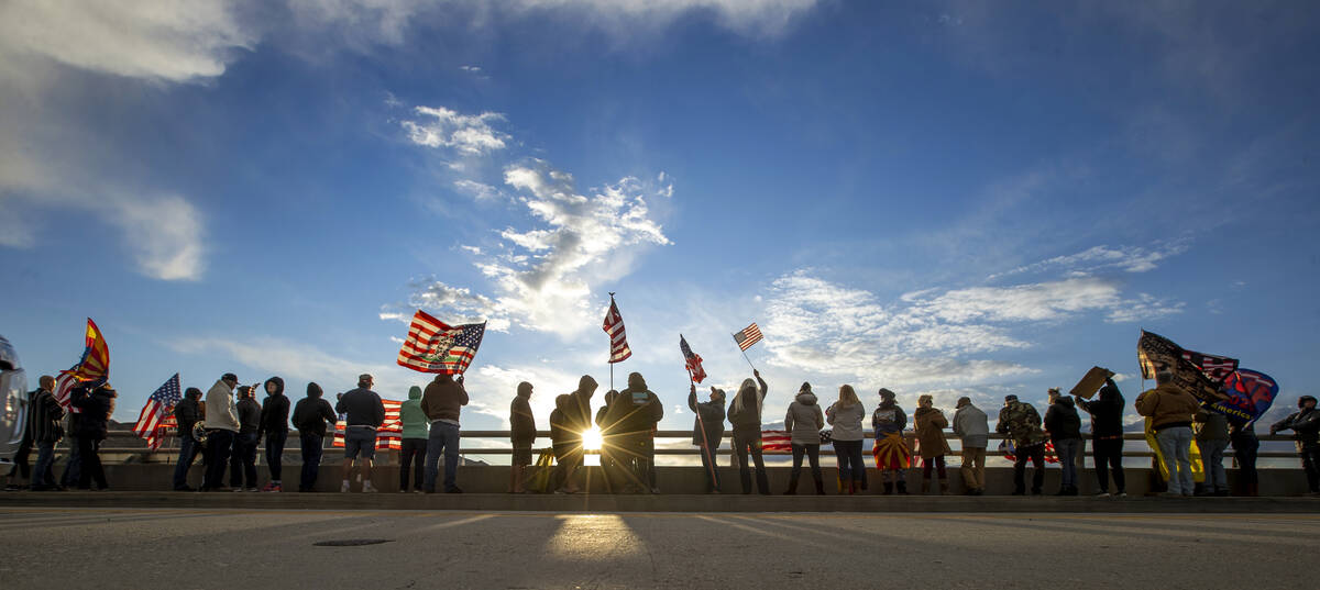Supporters line an I-40 overpass in Arizona awaiting The People’s Convoy who departed Ad ...